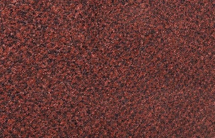 Global Red granite: a deep, uniform red polished surface with fine dark grain