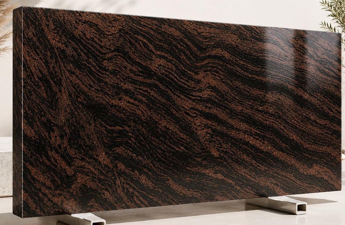 Himalyan Brown granite: banded copper, rust and black stripes flowing diagonally across a polished slab