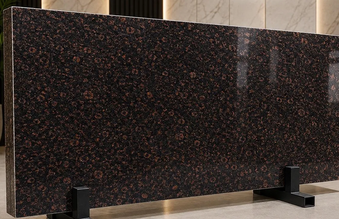 Madampally granite: fine coffee-brown rosettes evenly scattered on a polished black ground