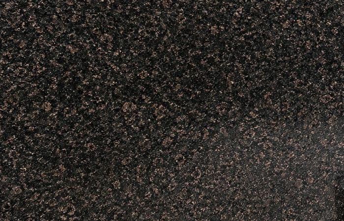 Shankrapally granite: a deep black polished surface scattered with warm copper-brown flecks